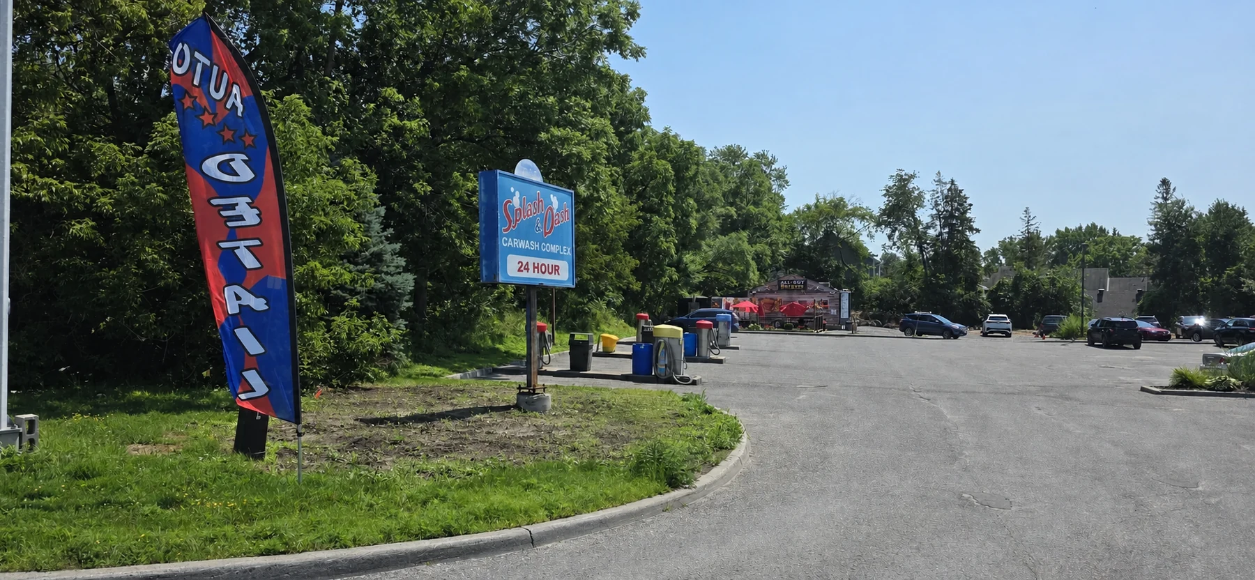 Splash & Dash roadside sign showing the car wash is open 24 hours