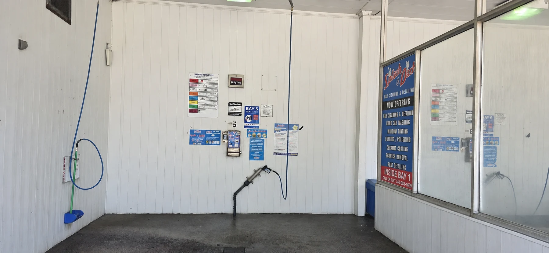 Inside one of the Splash & Dash self-serve wash bays
